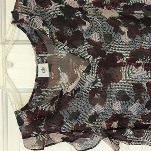 Cabi flutter sleeve top. Plum flowers on black background. Size S